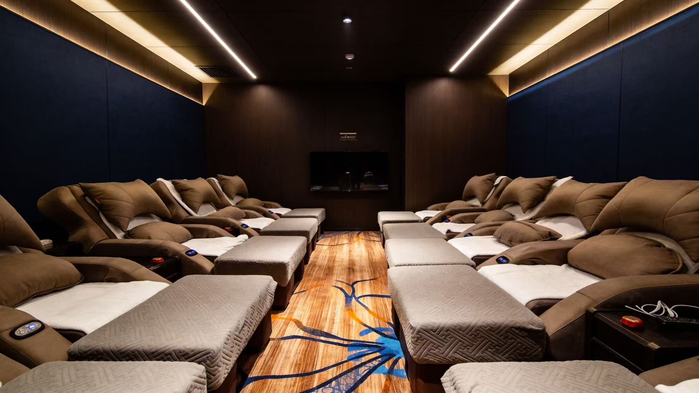 Spacious shared lounge with comfortable reclining chairs